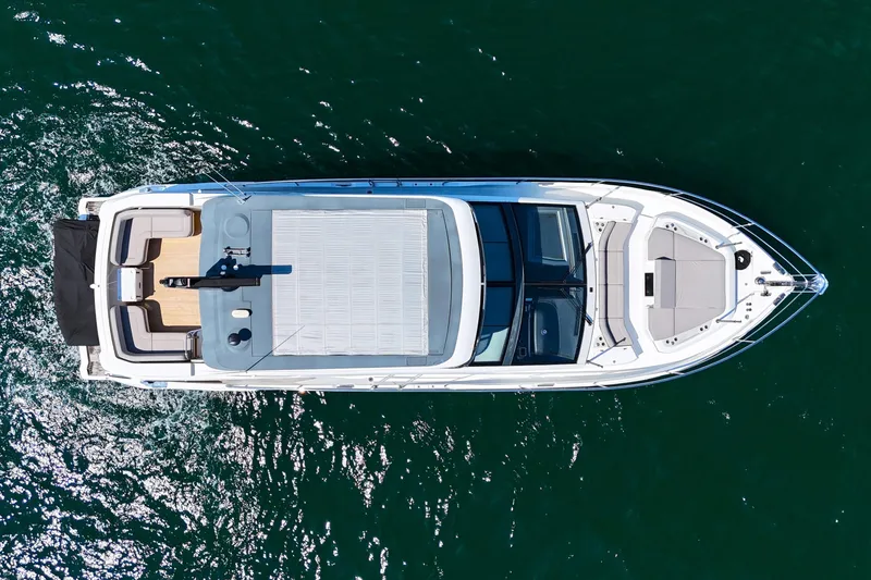 Slide: The Image of Aerial view of 2022 Pearl 62 yacht on open water. - 70