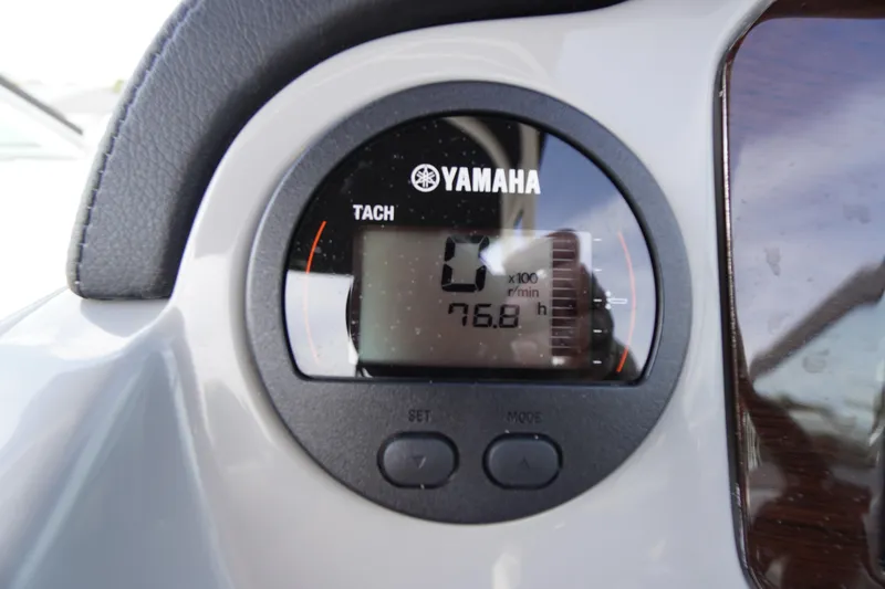 Slide: The Image of Yamaha tachometer on 2022 Chaparral 23 SSi OB boat dashboard, showing 76.8 hours. - 16