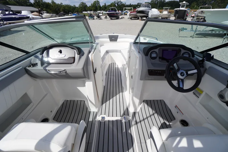 Slide: The Image of 2022 Chaparral 23 SSi OB boat interior with modern dashboard and seating. - 21