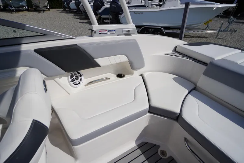Slide: The Image of 2022 Chaparral 23 SSi OB boat interior with white seating and speaker detail. - 26