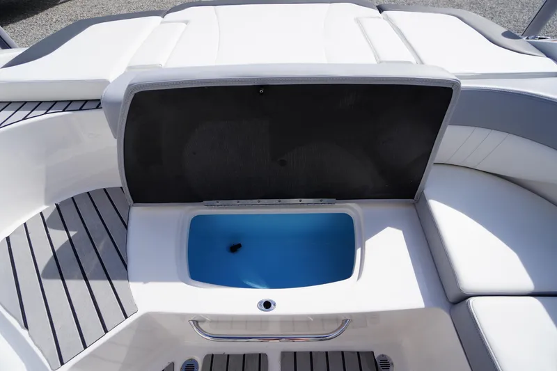 Slide: The Image of 2022 Chaparral 23 SSi OB boat interior with open storage compartment. - 27