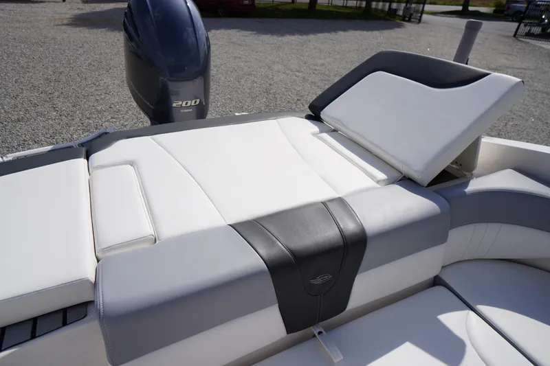 Slide: The Image of 2022 Chaparral 23 SSi OB boat with sleek white and gray seating, Yamaha 200 engine. - 32