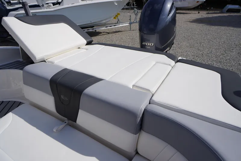 Slide: The Image of 2022 Chaparral 23 SSi OB boat with white and gray seating, featuring a Yamaha 200 outboard engine. - 34