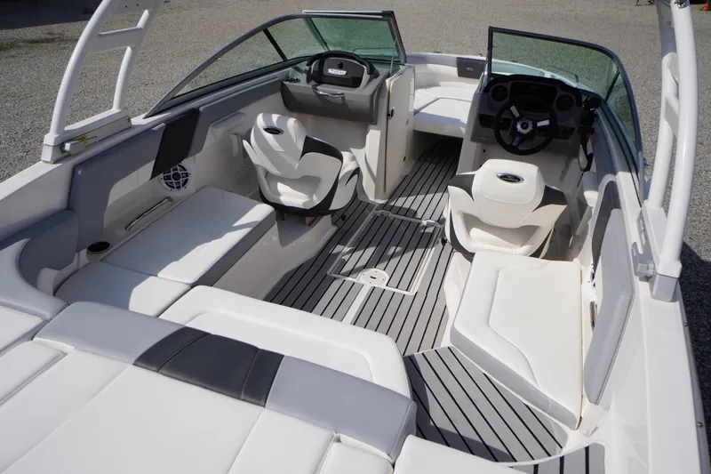 Slide: The Image of 2022 Chaparral 23 SSi OB boat interior with sleek seating and modern design. - 40