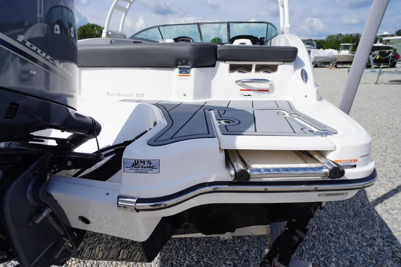Slide: The Image of 2022 Chaparral 23 SSi OB boat with swim platform and outboard motor. - 42