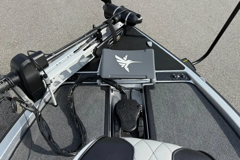 Slide: The Image of Front deck of 2026 Phoenix 920 Elite X boat with trolling motor and control panel. - 10