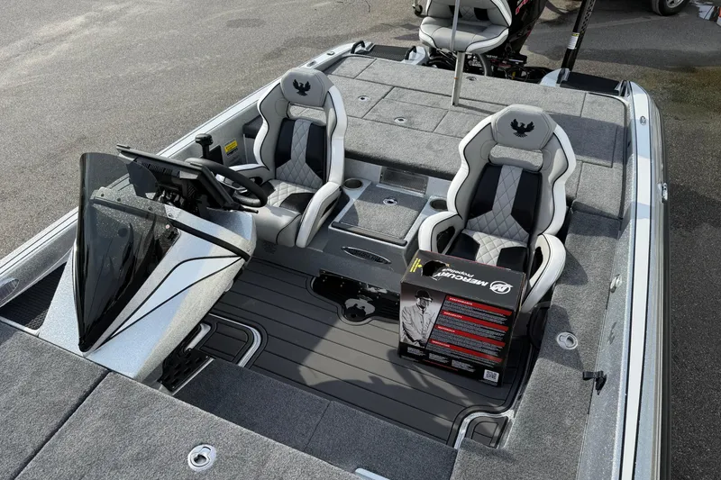 Slide: The Image of 2026 Phoenix 920 Elite X boat interior with dual seats and Mercury box on deck. - 12