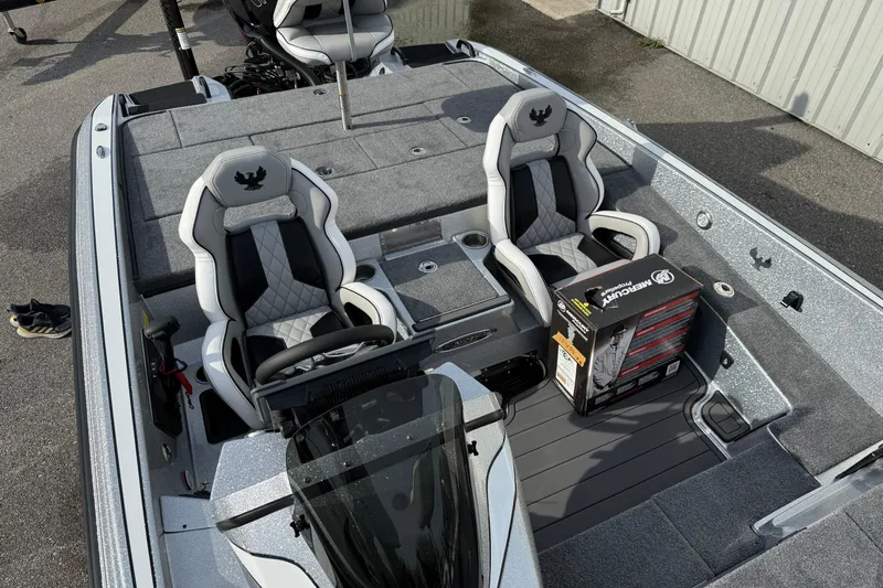 Slide: The Image of 2026 Phoenix 920 Elite X boat interior with two seats and a Mercury product box. - 14