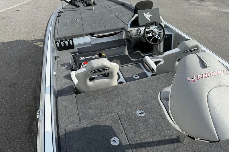 Slide: The Image of 2026 Phoenix 920 Elite X boat interior with steering wheel and seating. - 15