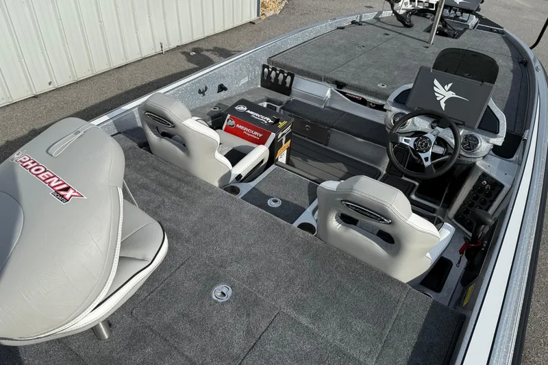 Slide: The Image of 2026 Phoenix 920 Elite X boat interior with modern seating and advanced dashboard controls. - 16