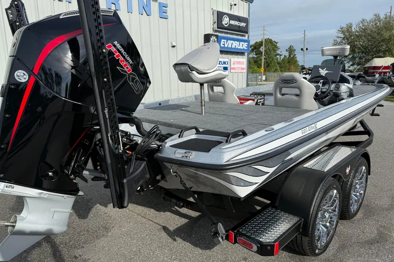 Slide: The Image of 2026 Phoenix 920 Elite X boat with Mercury Pro XS engine, parked outdoors. - 18