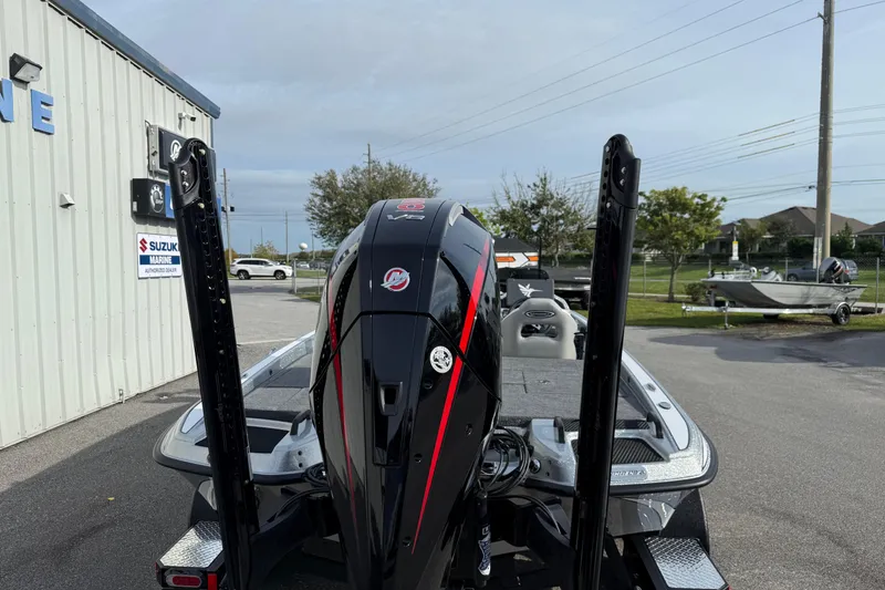 Slide: The Image of 2026 Phoenix 920 Elite X boat with powerful engine at a Suzuki Marine dealership. - 19