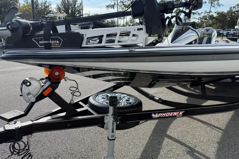 Slide: The Image of 2026 Phoenix 920 Elite X boat on trailer with Minn Kota Ultrex motor. - 4
