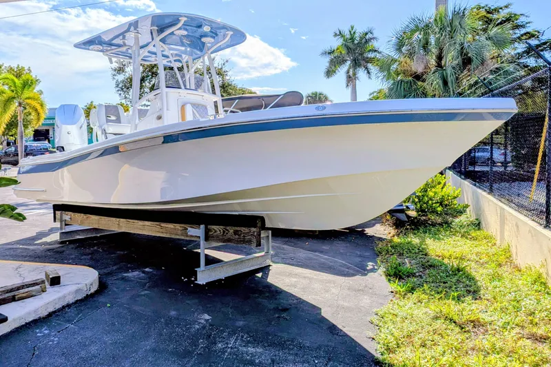 The Image of 2026 BlackJack 256 Coastal boat on trailer, sold, parked outdoors. - 0