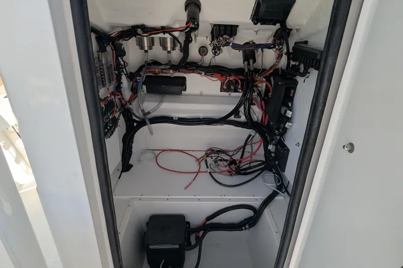 Slide: The Image of 2026 BlackJack 256 Coastal boat console with steering wheel and controls. - 4