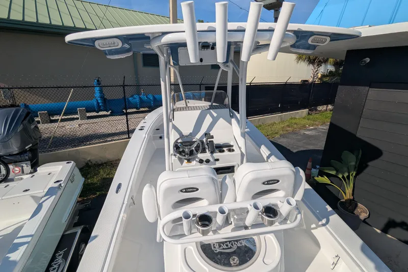 Slide: The Image of Electrical wiring compartment of 2026 BlackJack 256 Coastal boat, showcasing organized cables and components. - 5