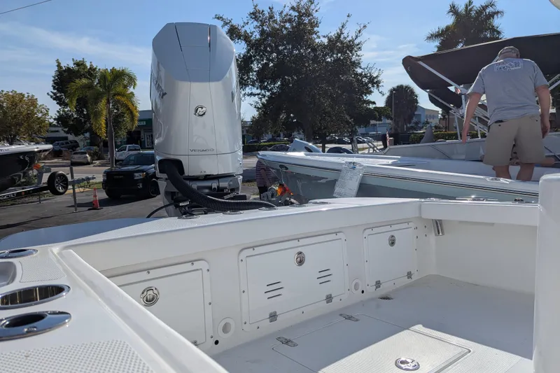 Slide: The Image of 2026 BlackJack 256 Coastal boat with dual cushioned seats and sleek design. - 9