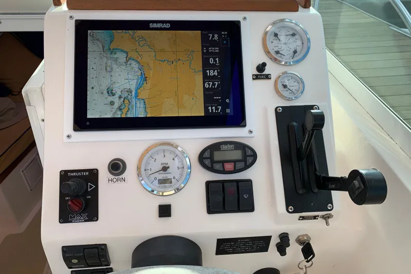 Slide: The Image of Control panel of 2004 Hunt Yachts Surfhunter 25 with navigation and gauges. - 36