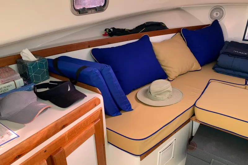 Slide: The Image of Interior of 2004 Hunt Yachts Surfhunter 25 with cozy seating and nautical decor. - 47