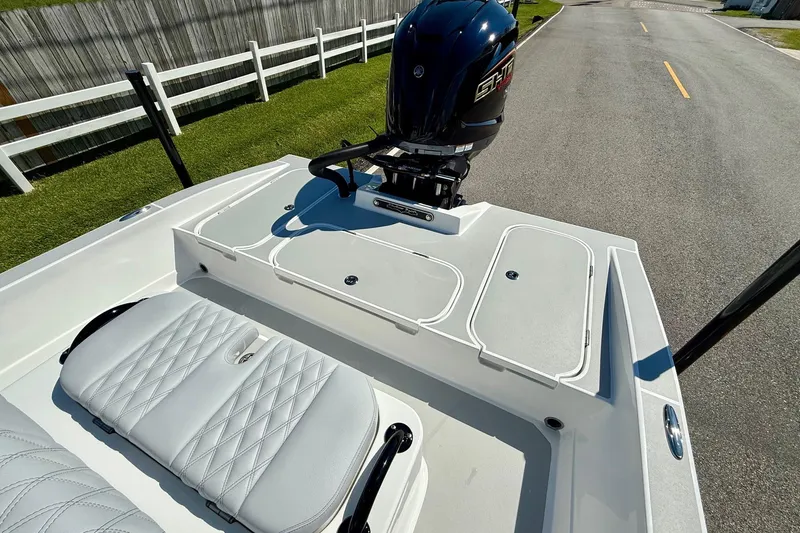 Slide: The Image of 2026 Shallow Sport 24 Modified V boat with sleek seating and powerful engine. - 7