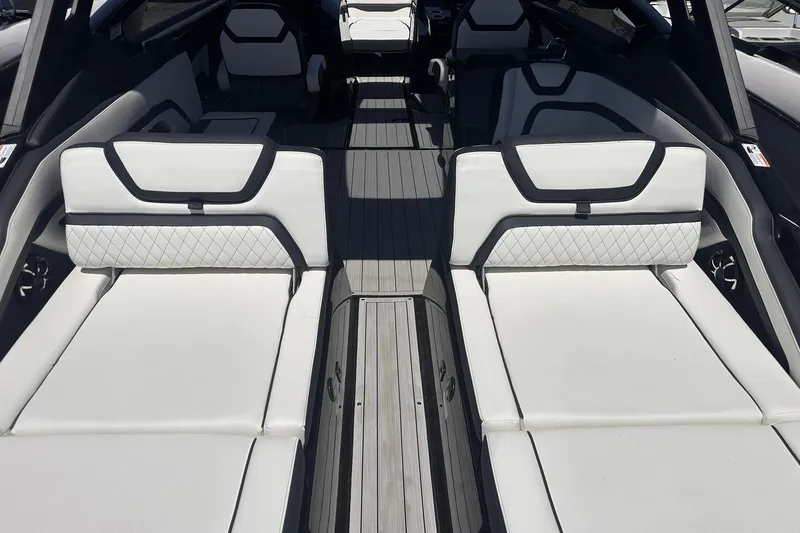 Slide: The Image of 2025 Yamaha Boats 275SD interior with sleek white seating and modern design. - 17
