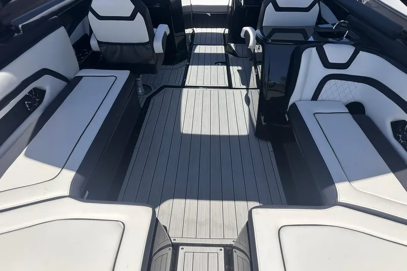Slide: The Image of 2025 Yamaha Boats 275SD interior with sleek seating and modern design. - 18