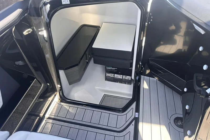 Slide: The Image of Interior cabin view of 2025 Yamaha Boats 275SD, featuring sleek design and modern amenities. - 26