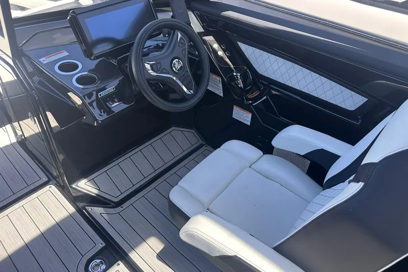Slide: The Image of 2025 Yamaha Boats 275SD cockpit with modern steering and sleek interior design. - 27