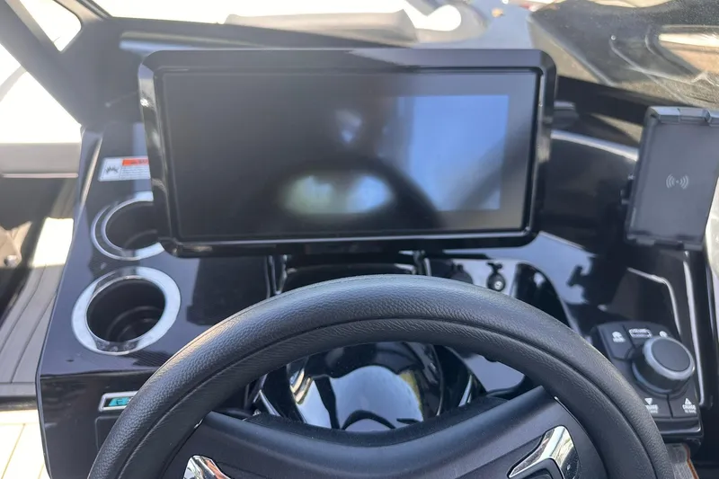 Slide: The Image of 2025 Yamaha Boats 275SD dashboard with touchscreen and steering wheel. - 33