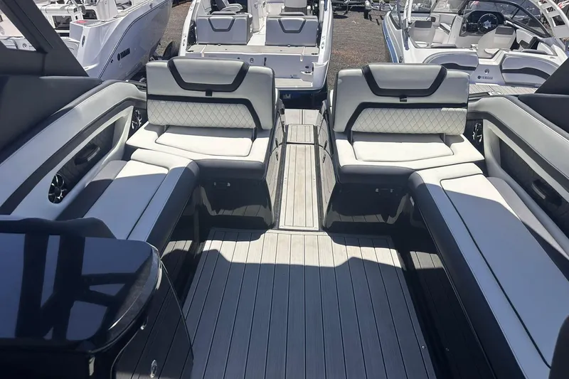 Slide: The Image of 2025 Yamaha Boats 275SD interior with luxurious seating and sleek design. - 43