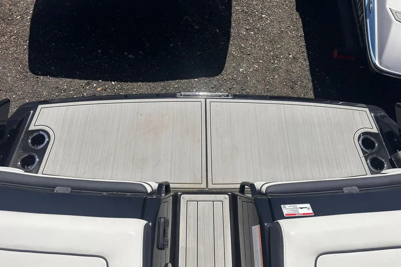 Slide: The Image of 2025 Yamaha Boats 275SD swim platform with cup holders, viewed from above. - 50