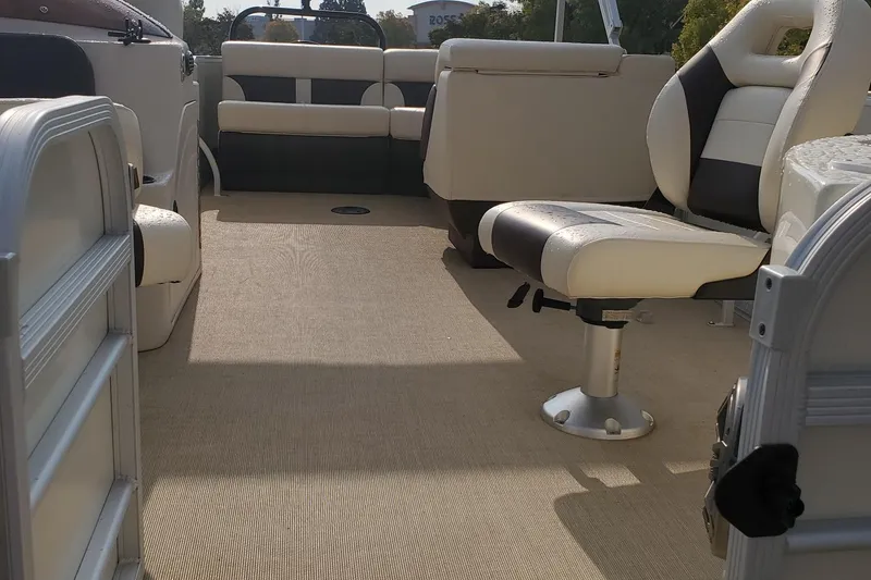Slide: The Image of 2023 Lexington 318s boat interior with beige and black seating, spacious layout. - 8