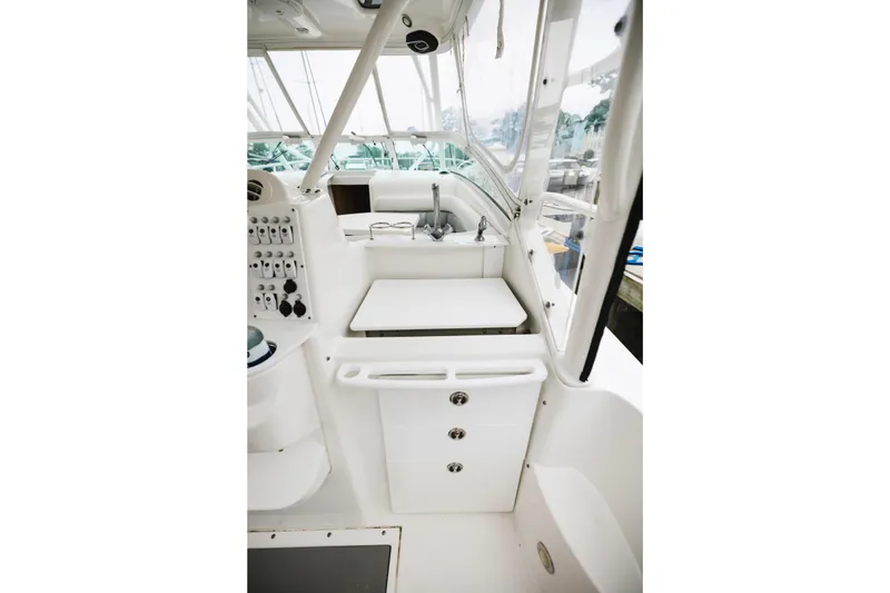 Slide: The Image of 2008 Everglades 350LX boat interior with sink and control panel. - 19