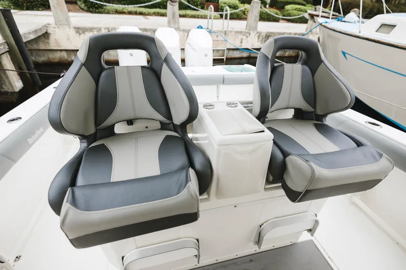 Slide: The Image of Luxury seating on a 2008 Everglades 350LX boat, featuring dual cushioned chairs. - 21
