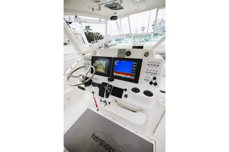 Slide: The Image of 2008 Everglades 350LX boat helm with advanced navigation displays and controls. - 22