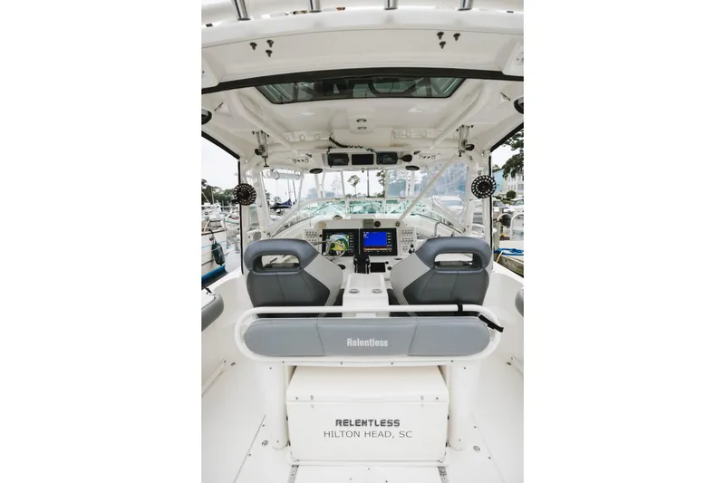 Slide: The Image of 2008 Everglades 350LX boat interior with helm, seats, and electronics at Hilton Head, SC marina. - 27