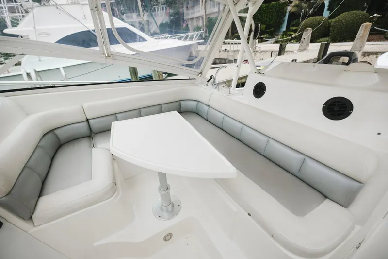 Slide: The Image of 2008 Everglades 350LX boat interior with white seating and table. - 31