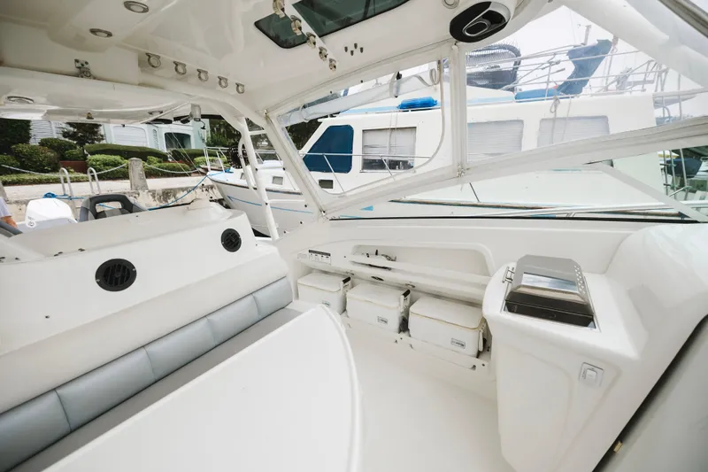 Slide: The Image of Interior of a 2008 Everglades 350LX boat, featuring seating and storage compartments. - 33