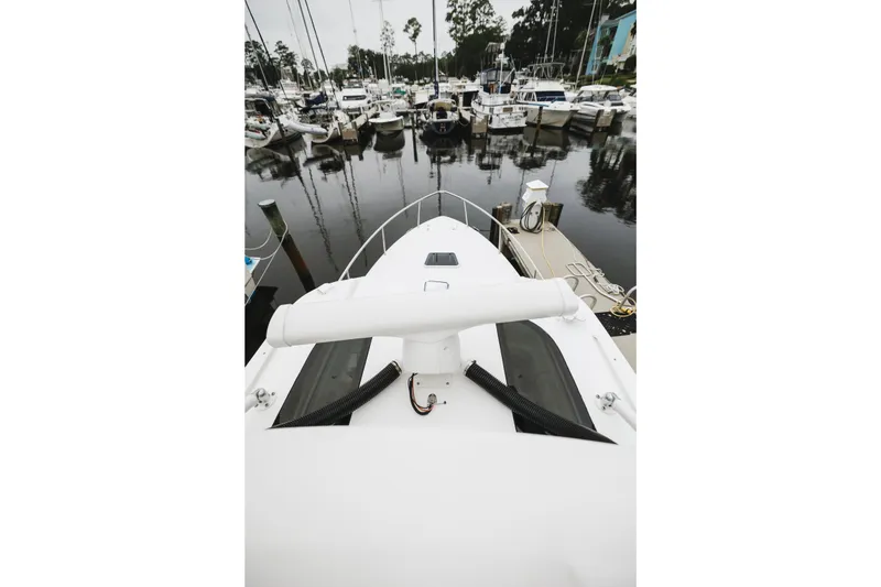 Slide: The Image of Bow view of 2008 Everglades 350LX boat docked in a marina. - 44