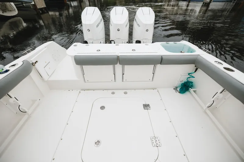 Slide: The Image of 2008 Everglades 350LX boat deck with triple Mercury outboard engines. - 48