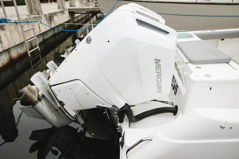 Slide: The Image of 2008 Everglades 350LX boat with Mercury outboard engine in a marina setting. - 7