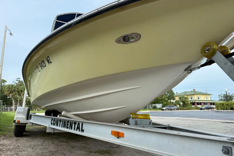 Slide: The Image of 2006 ShearWater Z2200 boat on Continental trailer, parked outdoors. - 11