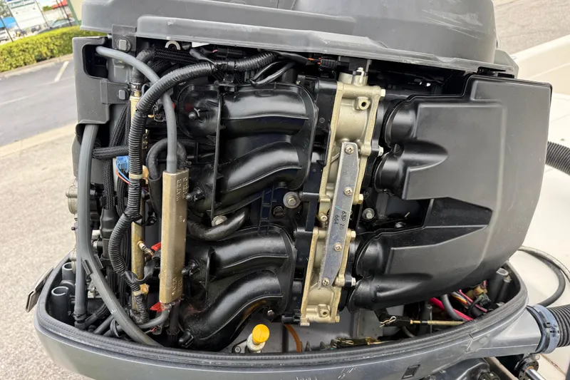 Slide: The Image of 2006 ShearWater Z2200 outboard engine, detailed view of internal components and wiring. - 16