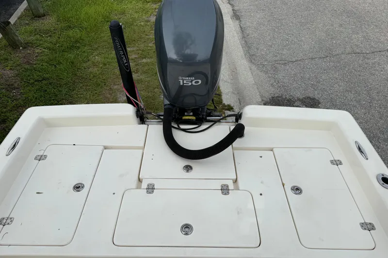 Slide: The Image of 2006 ShearWater Z2200 boat with Yamaha 150 outboard motor on a trailer. - 21