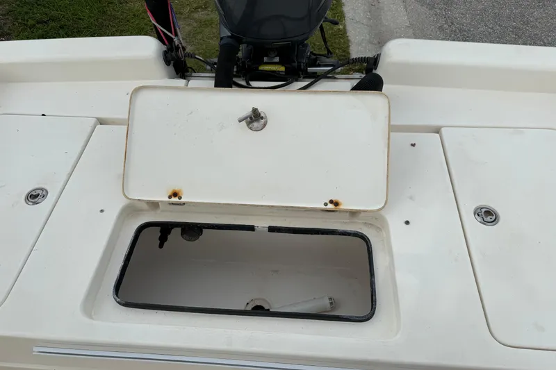 Slide: The Image of Open storage compartment on 2006 ShearWater Z2200 boat deck, showing interior details. - 23