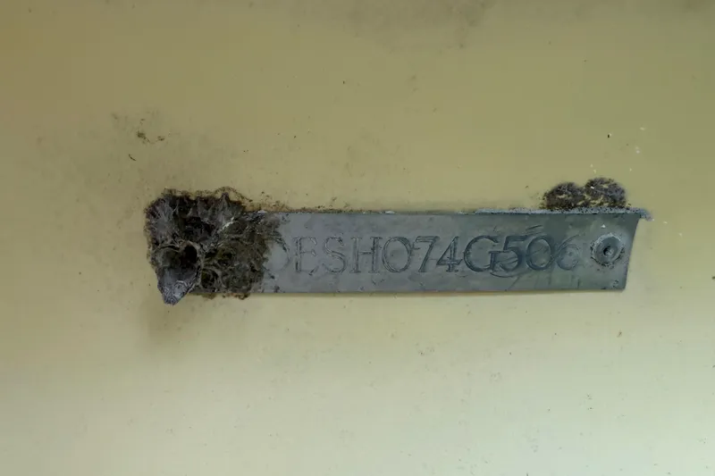 Slide: The Image of ShearWater Z2200 2006 boat hull identification number plate with corrosion. - 46
