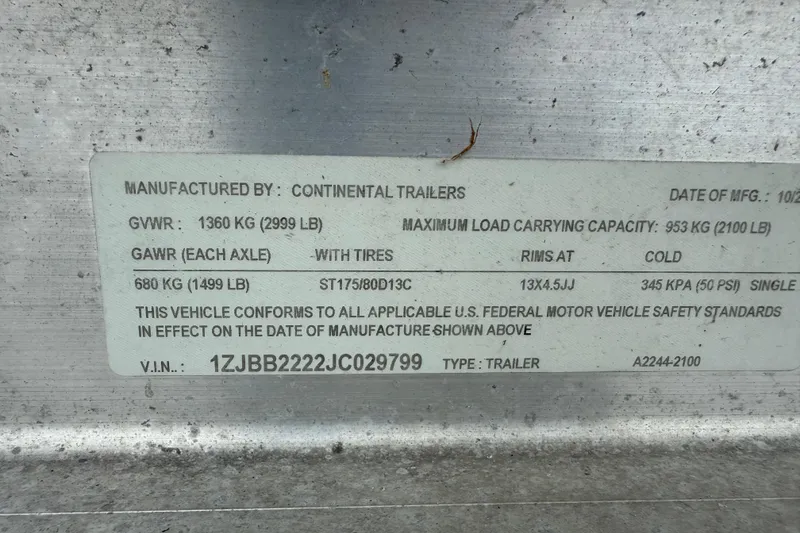 Slide: The Image of Trailer specification label from Continental Trailers, detailing weight and safety standards. - 47