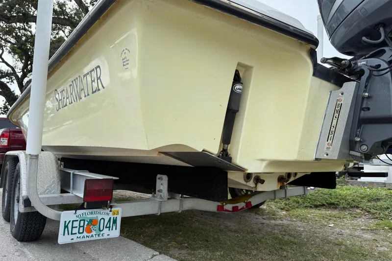 Slide: The Image of 2006 ShearWater Z2200 boat on trailer with Florida license plate. - 8