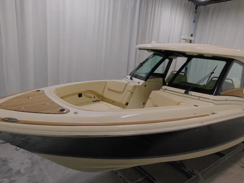 Slide: The Image of 2024 Chris-Craft Calypso 32 boat in showroom, side view. - 4