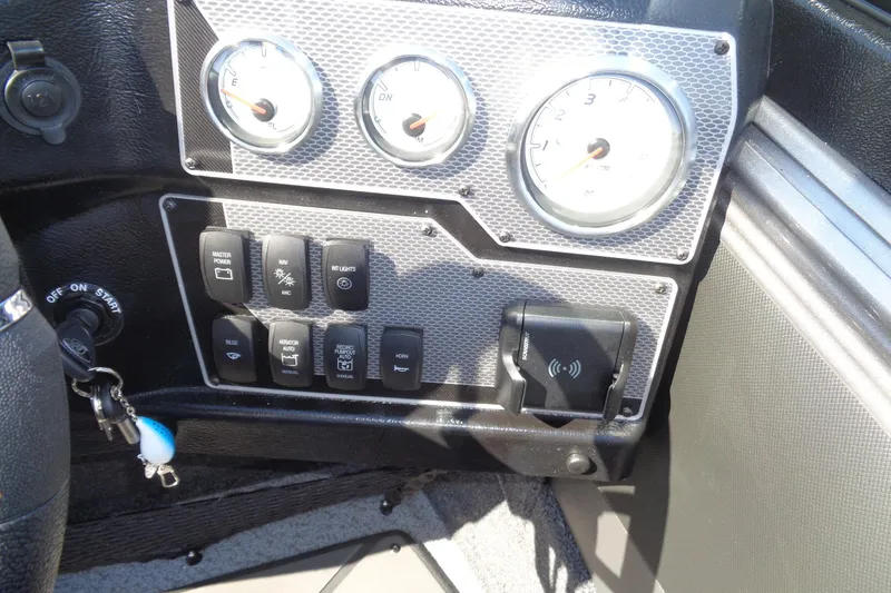 Slide: The Image of Dashboard of 2026 Lund 1975 Tyee boat with gauges and control switches. - 21